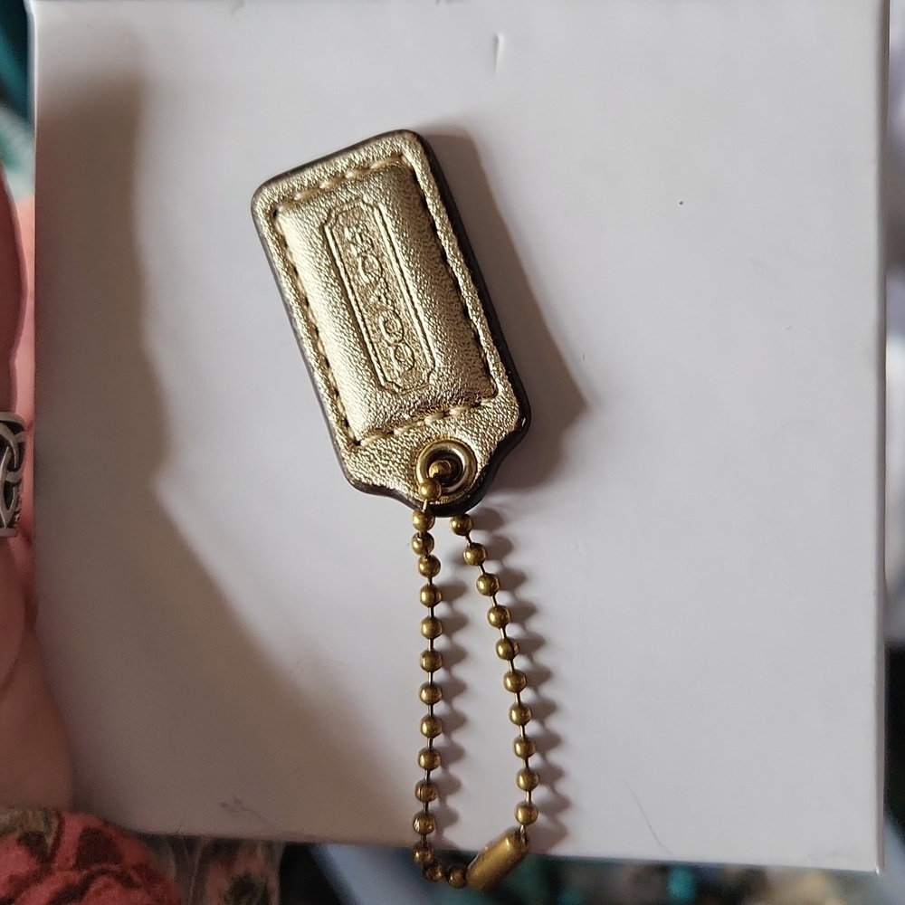 Coach  charm chain preloved